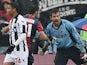 Bologna's Cianluca Curci celebrates after saving Udinese forward Antonio Di Natale's penalty on March 30, 2013