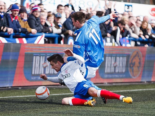 Rangers' Ian Black and Montrose's Scott Johnston battles for the ball on March 30, 2013