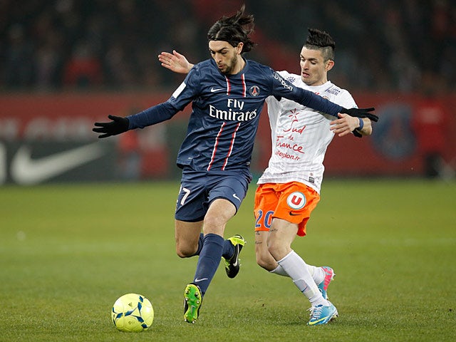 PSG's Javier Pastore and Montpellier's Remy Cabella battle for the ball on March 29, 2013