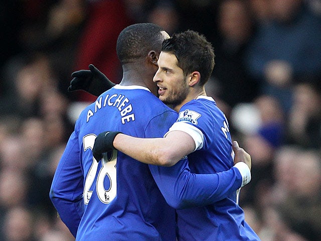 Kevin Mirallas is congratulated by team mate Victor Anichebe after scoring the opening goal against Stoke on March 30, 2013