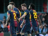 Barcelona's Lionel Messi is congratulated by team mates after scoring his team's second against Celta Vigo on March 30, 2013