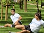 Uruguay players Luis Suarez and Edinson Cavani stretch inside the Olympic athletes village on July 30, 2012