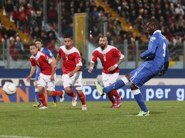 Italy striker Mario Balotelli dispatches a penalty against Malta on March 26, 2013