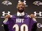Michael Huff poses with a Ravens jersey during a press conference on March 28, 2013