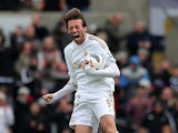Michu celebrates moments after grabbing a goal back against Spurs on March 30, 2013