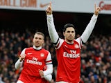 Mikel Arteta celebrates after converting a penalty to score his team's fourth against Reading on March 30, 2013