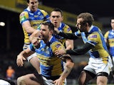 Leeds Rhinos' Mitch Achurch is congratulated by team mates after scoring a try against Bradford Bulls on March 28, 2013