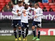 Bolton's Mohamed Kamara celebrates with team mates after scoring his team's second against Charlton on March 30, 2013