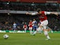 Olivier Giroud scores his team's third against Reading on March 30, 2013