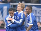 Schalke's Raffael is congratulated by team mates after scoring his team's second against Hoffenheim on March 30, 2013