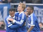 Schalke's Raffael is congratulated by team mates after scoring his team's second against Hoffenheim on March 30, 2013