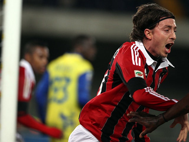 AC Milan's Riccardo Montolivo celebrates after scoring the opening goal against Chievo on March 30, 2013