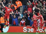Rickie Lambert is joined by team mates as he celebrates scoring his team's second against Chelsea on March 30, 2013