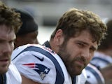 Patriots' Sebastian Vollmer sits on the sidelines during the game with Jacksonville on December 23, 2012
