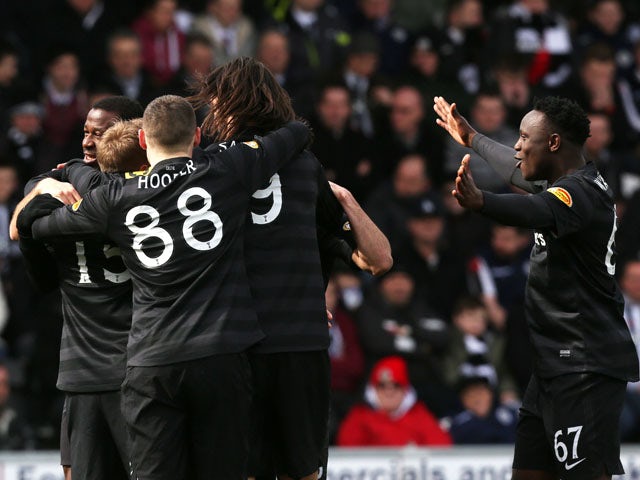 Celtic players celebrate Kris Commons goal in the SPL clash at St Mirren on March 31, 2013