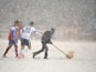 Groundsman removes snow during the USA verses Costa Rica World Cup Qualifying match on March 22, 2013