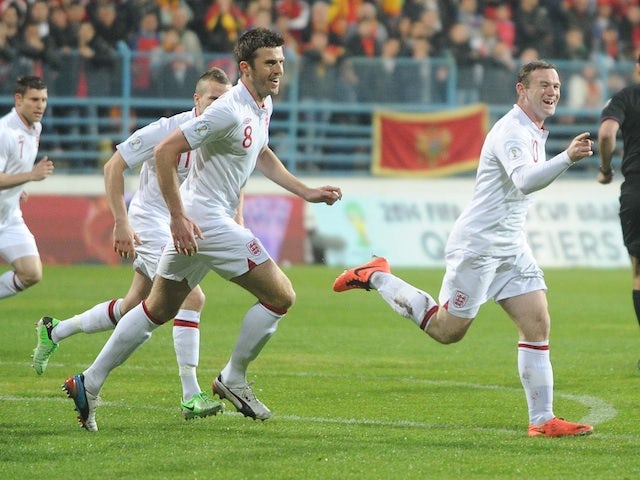 England's Wayne Rooney celebrates scoring an early header against Montenegro on March 26, 2013