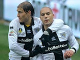 Parma's Yohan Benalouane is congratulated by team mate Gabriel Paletta after scoring the opening goal against Pescara on March 30, 2013