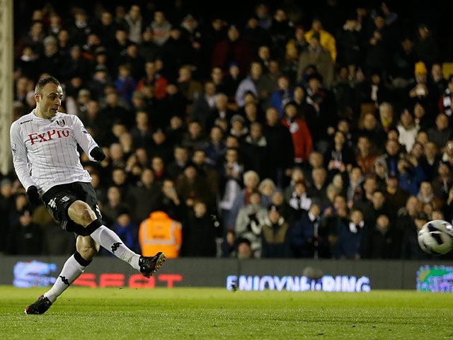 Dimitar Berbatov scores the opening goal from the penalty spot against QPR on April 1, 2013