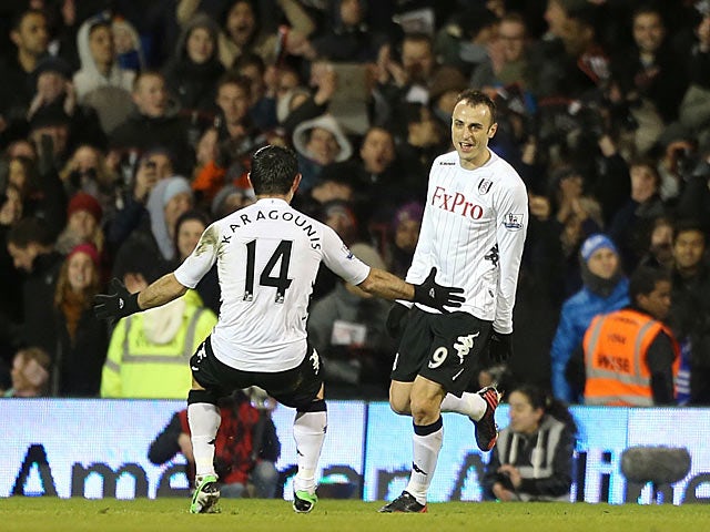 Dimitar Berbatov is congratulated by team mate Giorgos Karagounis after scoring his second against QPR on April 1, 2013