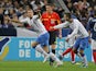 Bosnia's Edin Dzeko is congratulated by team mate Miralem Pjanic after scoring on October 12, 2011