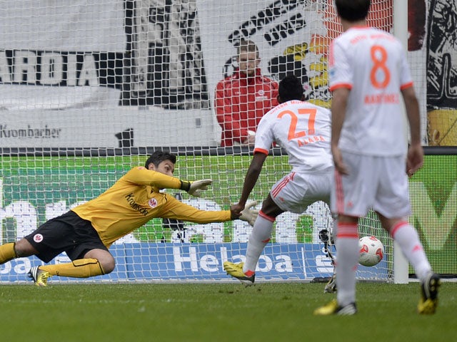 Bayern Munich's David Alaba misses a penalty during his side's match with Eintracht Frankfurt on April 6, 2013