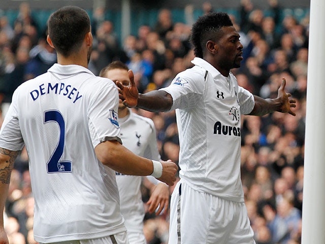 Emmanuel Adebayor is congratulated by team mate Clint Dempsey after scoring the opening goal against Everton on April 7, 2013