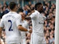 Emmanuel Adebayor is congratulated by team mate Clint Dempsey after scoring the opening goal against Everton on April 7, 2013