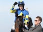 Ryan Mania celebrates on Auroras Encore after winning the John Smith's Grand National Chase on April 6, 2013