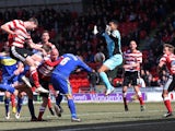 Doncaster's Jamie McCombe scores the winning goal against Swindon on April 1, 2013