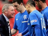 Rangers boss Ally McCoist congratulates his player Kane Hemmings after scoring against Queens Park on April 7, 2013