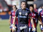 San Lorenzo's goalkeeper Pablo Migliore walks on to the pitch with teammates on March 16, 2013