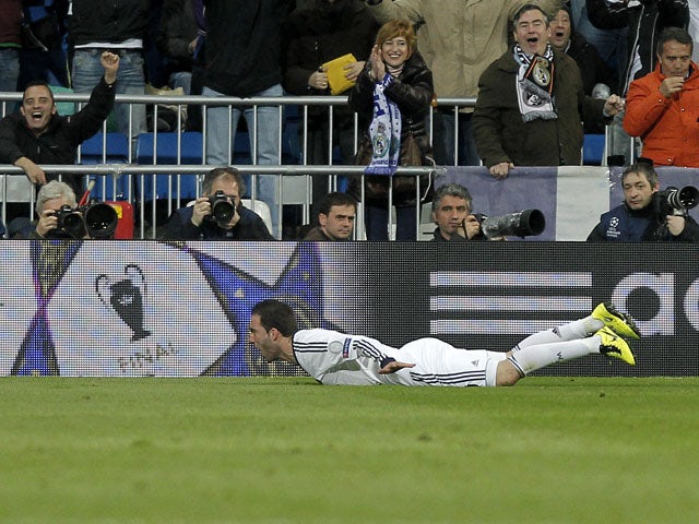 Real Madrid's Gonzalo Higuain celebrates scoring his side's third goal in their match against Galatasaray on April 3, 2013