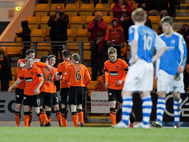 Dundee United's Ryan Gauld is congratulated by team mates after scoring the opener against St Johnstone on April 1, 2013