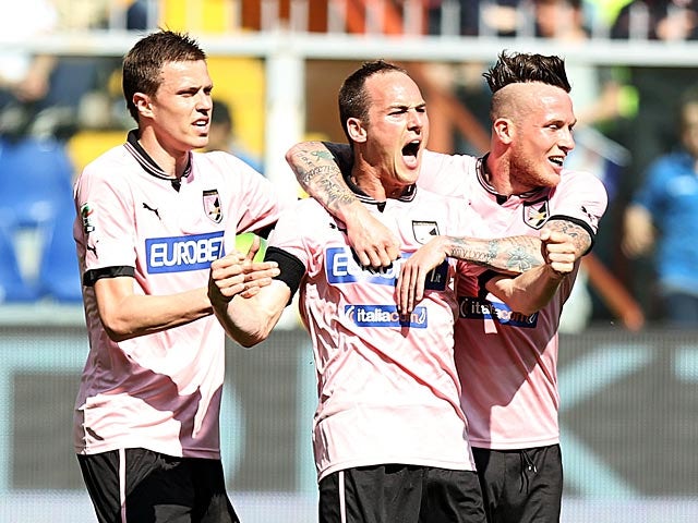 Palermo's Steve Von Bergen is congratulated by team mates after scoring the opening goal against Sampdoria on April 7, 2013