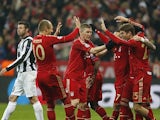 Bayern's Thomas Mueller is congratulated by team mates after scoring his team's second against Juventus on April 2, 2013