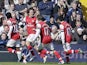 Arsenal's Tomas Rosicky celebrates after scoring against West Bromwich Albion on April 6, 2013