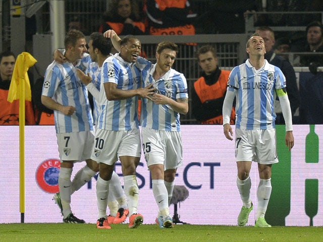 Malaga players celebrate after Joaquin's goal in the Champions League match against Borussia Dortmund on April 9, 2013