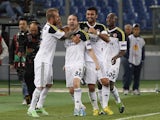 Fener's Caner Erkin celebrates with teammates after scoring a goal Lazio on April 11, 2013