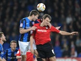 Cardiff City's Ben Turner and Barnsley's Richard Foster battle for the ball during the Championship match on April 9, 2013