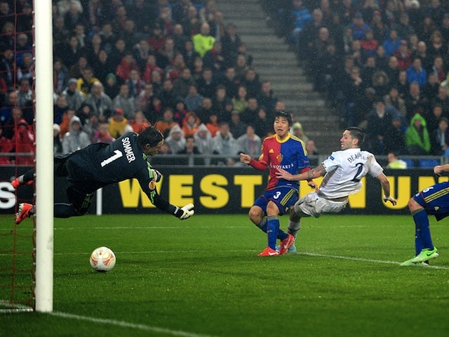 Spurs' Clint Dempsey scores his second goal against Basel on April 11, 2013