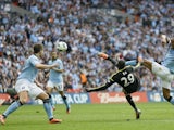 Chelsea striker Demba Ba scores against Man City on April 14, 2013