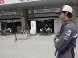 Sauber's Esteban Gutierrez stands in front of the pit lane on at the Chinese GP on April 14, 2013