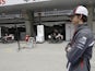 Sauber's Esteban Gutierrez stands in front of the pit lane on at the Chinese GP on April 14, 2013