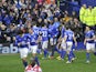 Everton players celebrate their second goal in the Premier League match against QPR on April 13, 2013