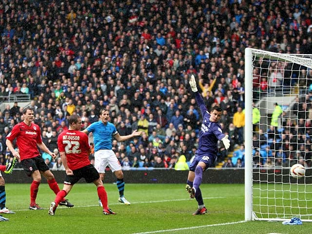 Cardiff's Heidar Helguson heads in the opening goal in the match against Nottingham Forest on April 13, 2013 