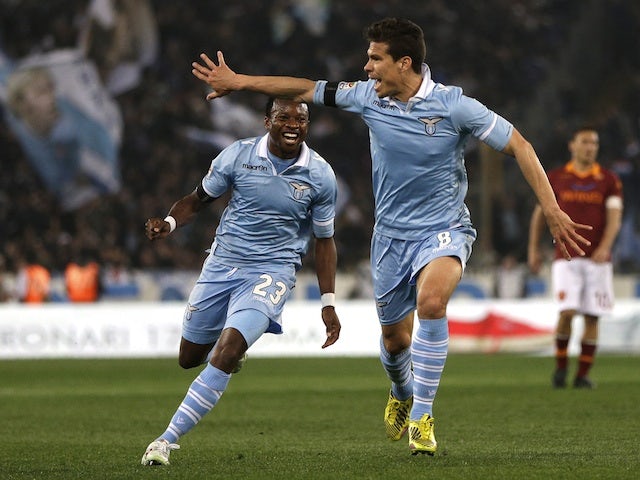 Lazio's Hernanes celebrates a goal in the derby against Roma on April 8, 2013