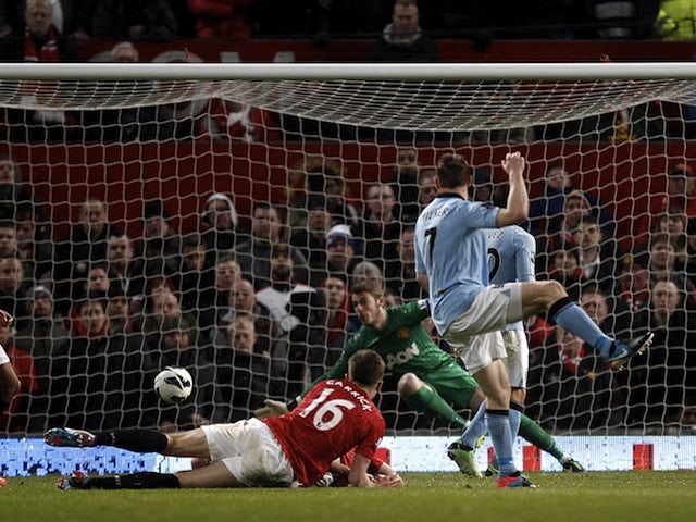 James Milner opens the scoring for City against United on April 8, 2013