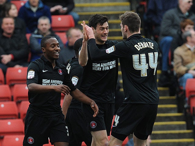 Charton's Johnnie Jackson is congratulated by teammates after scoring his team's second against Barnsley on April 14, 2013