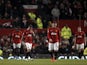 United players walk off dejected following defeat to Man City on April 8, 2013